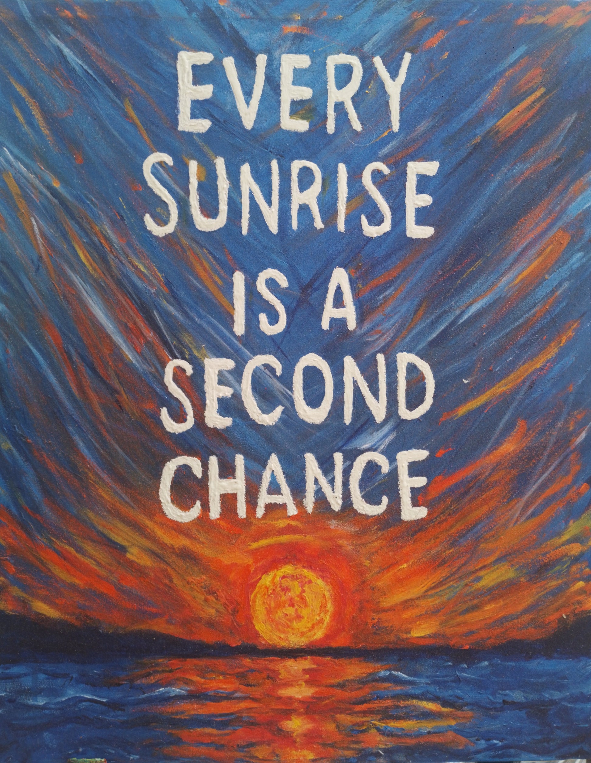 Inspirational sunrise painting with quote Every Sunrise Is a Second Chance in bold white letters on vibrant blue and orange sky over ocean