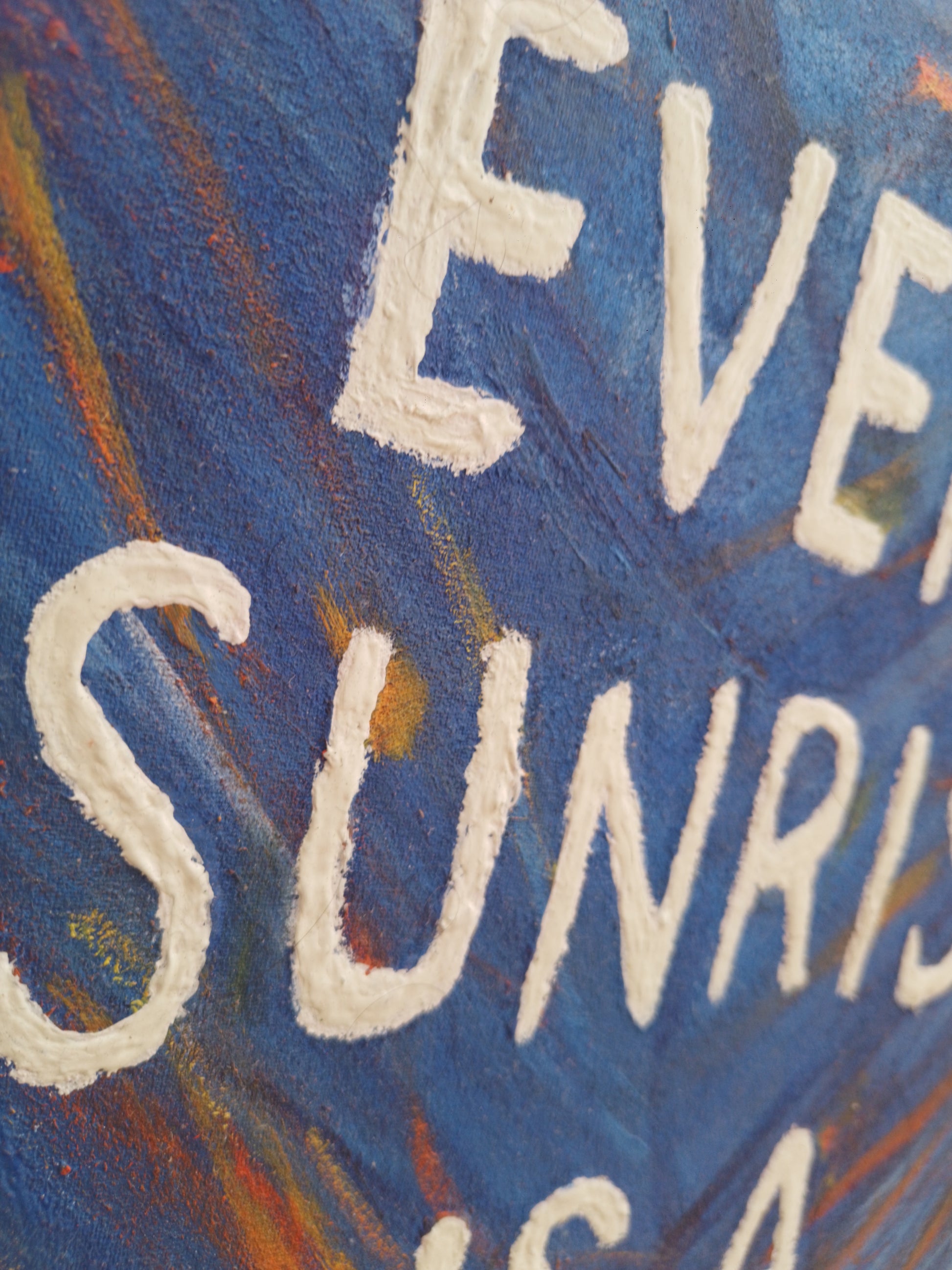 Close-up of glowing orange sun over blue ocean from inspirational sunrise painting with rich color strokes