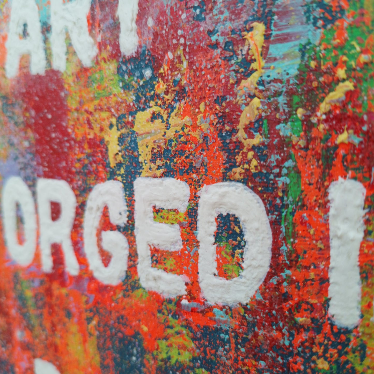 “Close-up of textured brush strokes and vibrant colors in expressionist painting ‘Art Is Forged in Pain."