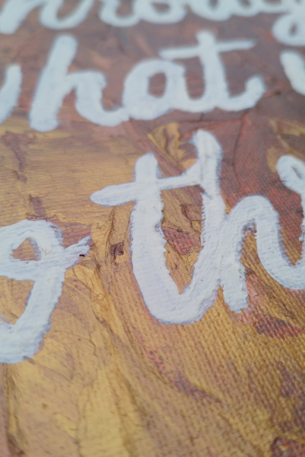 “Detail view of glow in the dark paint effect on motivational expressionism artwork ‘Grow Through What You Go Through."